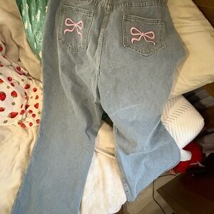 Stylish Blue Jeans with Pink Bow Accents